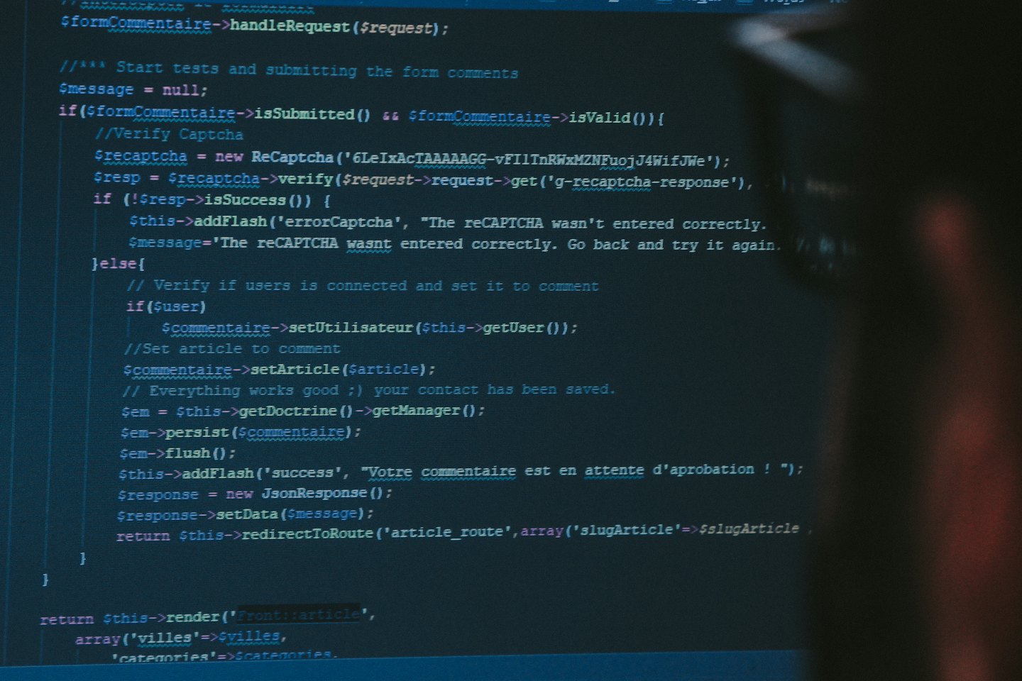 Lines of computer code displayed on a monitor screen.